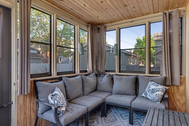 sunroom / solarium featuring an outdoor hangout area and wood ceiling