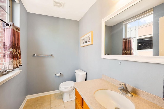 612 N Midvale Blvd, Madison, WI 53705 - bathroom with toilet, tile patterned flooring, vanity, and baseboards