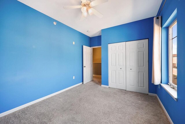 612 N Midvale Blvd, Madison, WI 53705 - unfurnished bedroom with carpet, a closet, baseboards, and a ceiling fan