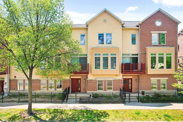 612 N Midvale Blvd, Madison, WI 53705 - view of property with brick siding and a fenced front yard