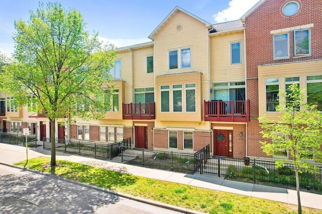 612 N Midvale Blvd, Madison, WI 53705 - multi unit property with brick siding and a fenced front yard