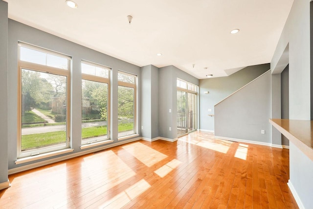 612 N Midvale Blvd, Madison, WI 53705 - unfurnished living room featuring light wood-style flooring, baseboards, and recessed lighting