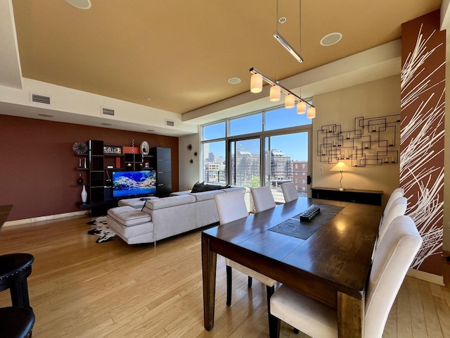 106 W Seeboth St Unit 503, Milwaukee, WI 53204 - dining area featuring light wood-style floors and baseboards
