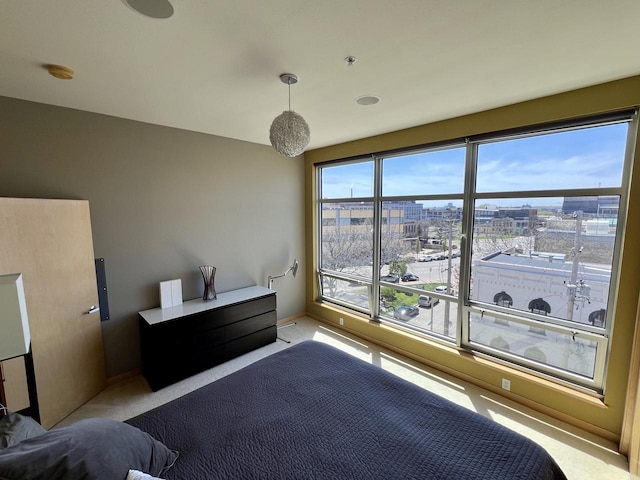 106 W Seeboth St Unit 503, Milwaukee, WI 53204 - carpeted bedroom with baseboards and a city view