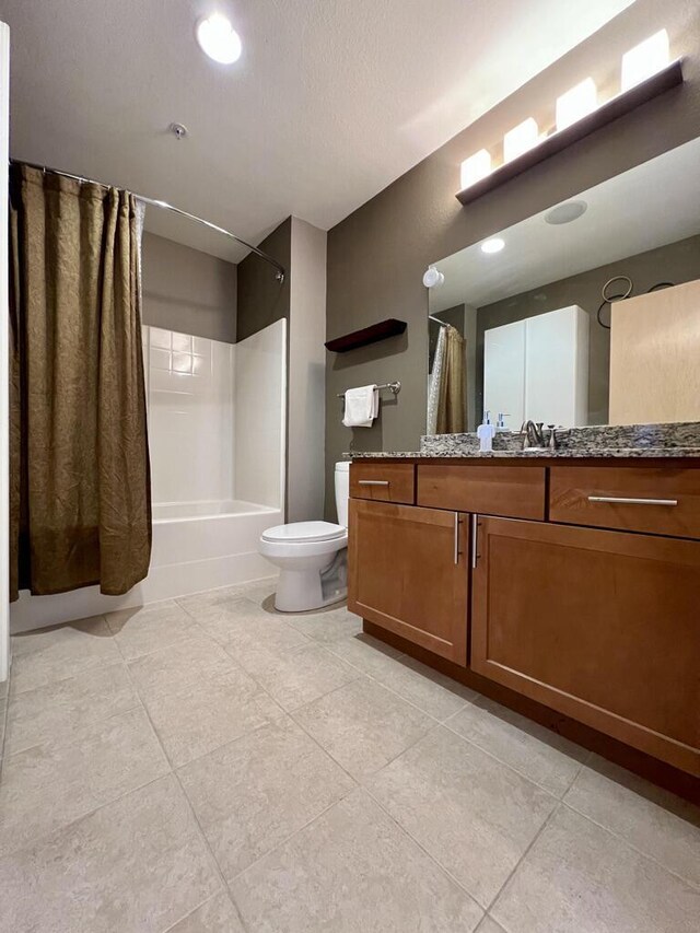 106 W Seeboth St Unit 503, Milwaukee, WI 53204 - bathroom featuring tile patterned flooring, shower / tub combo, vanity, and toilet