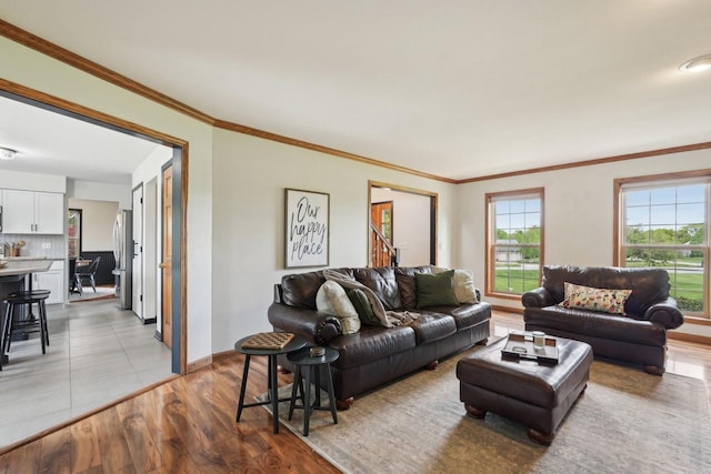 W308S2787 Wild Berry Ct, Waukesha, WI 53188 - living room with light wood-style flooring, baseboards, and ornamental molding