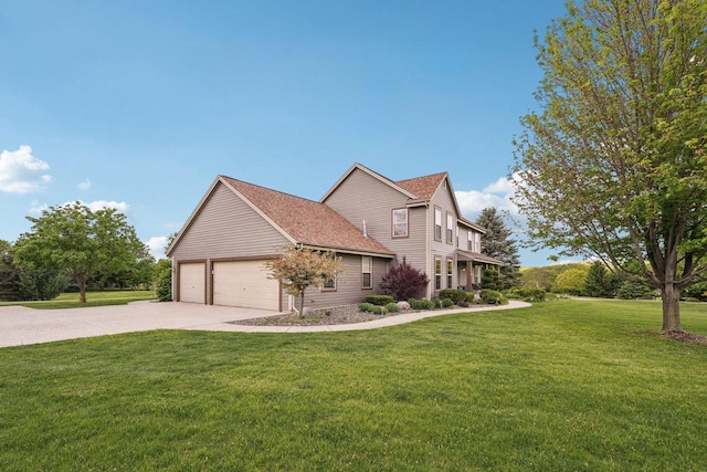 W308S2787 Wild Berry Ct, Waukesha, WI 53188 - view of side of property with concrete driveway, a yard, a garage, and a shingled roof