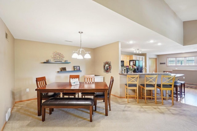 802 Herndon Dr Unit C, Madison, WI 53718 - dining space featuring light colored carpet, baseboards, a chandelier, and recessed lighting