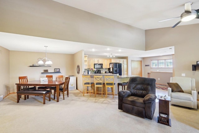 802 Herndon Dr Unit C, Madison, WI 53718 - living area featuring light colored carpet, a chandelier, recessed lighting, a high ceiling, and a ceiling fan