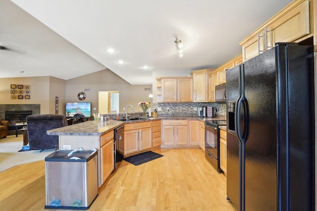 802 Herndon Dr Unit C, Madison, WI 53718 - kitchen with black appliances, light brown cabinets, a sink, a peninsula, and open floor plan