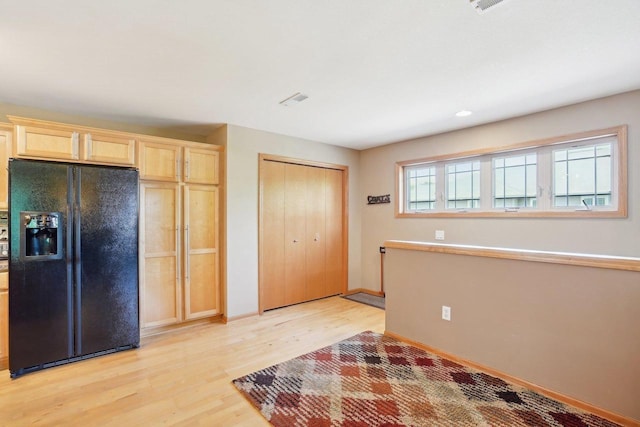 802 Herndon Dr Unit C, Madison, WI 53718 - kitchen featuring black fridge, light wood-type flooring, light brown cabinets, baseboards, and recessed lighting