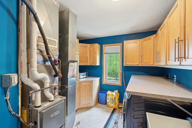 802 Herndon Dr Unit C, Madison, WI 53718 - washroom with cabinet space and heating unit