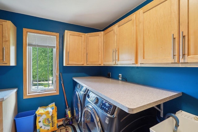 802 Herndon Dr Unit C, Madison, WI 53718 - clothes washing area with washer and dryer and cabinet space
