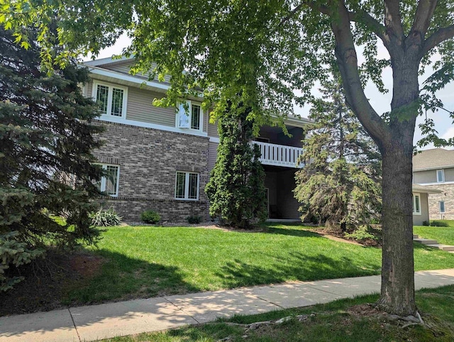 802 Herndon Dr Unit C, Madison, WI 53718 - view of property hidden behind natural elements with brick siding and a front lawn