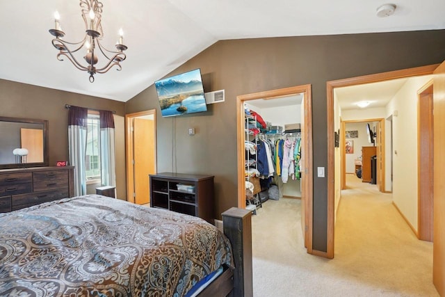 802 Herndon Dr Unit C, Madison, WI 53718 - carpeted bedroom with a spacious closet, vaulted ceiling, a chandelier, and a closet