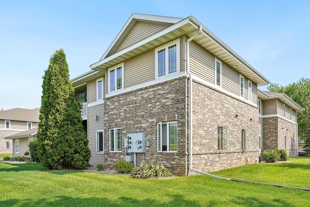 802 Herndon Dr Unit C, Madison, WI 53718 - view of side of property featuring brick siding and a yard