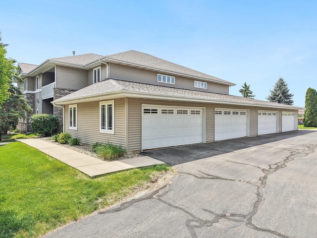 802 Herndon Dr Unit C, Madison, WI 53718 - view of front of house featuring a front yard and driveway