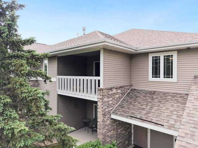 802 Herndon Dr Unit C, Madison, WI 53718 - view of side of home with roof with shingles and brick siding