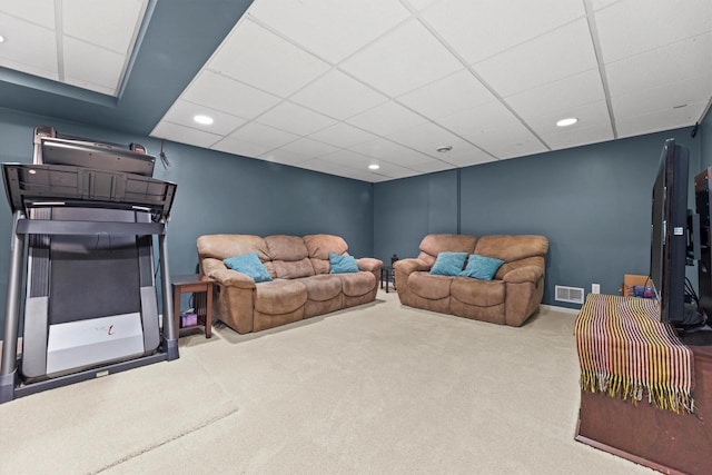 carpeted living room with a paneled ceiling and recessed lighting