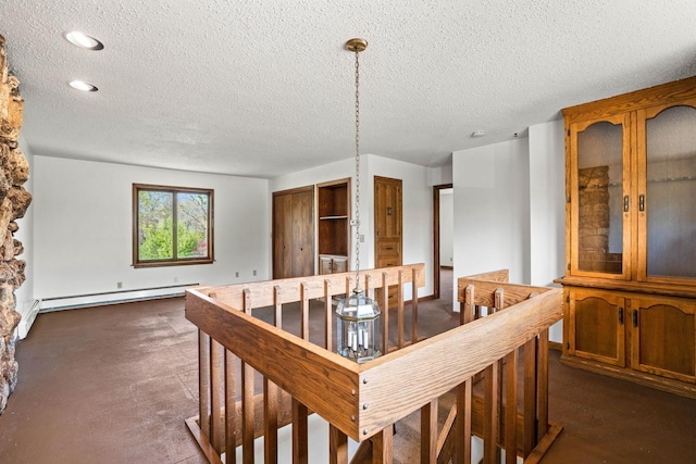 9 Sandalwood Ct, Wind Point, WI 53402 - dining area with a baseboard heating unit, a textured ceiling, and recessed lighting