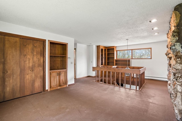 9 Sandalwood Ct, Wind Point, WI 53402 - interior space with a baseboard heating unit, a textured ceiling, recessed lighting, and baseboards