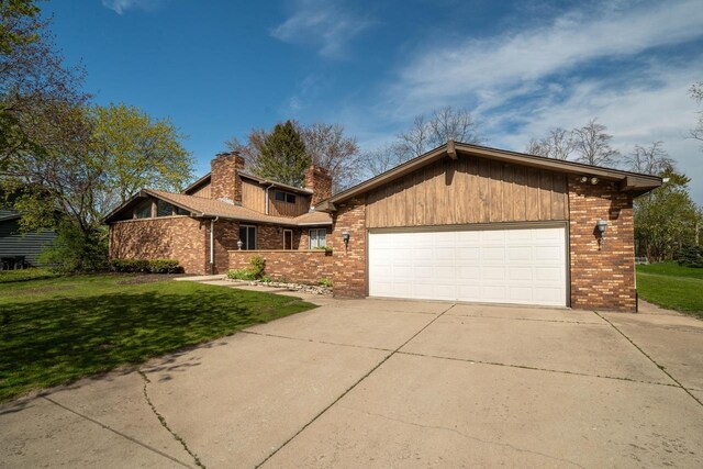 9 Sandalwood Ct, Wind Point, WI 53402 - mid-century modern home featuring brick siding, a front yard, a chimney, and driveway