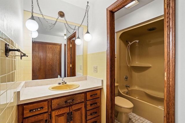 9 Sandalwood Ct, Wind Point, WI 53402 - bathroom with tile walls, toilet, bathing tub / shower combination, and vanity
