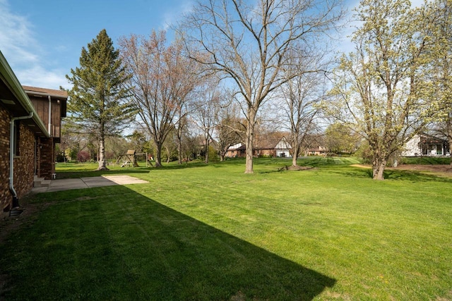 9 Sandalwood Ct, Wind Point, WI 53402 - view of grassy yard with a playground