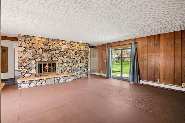 9 Sandalwood Ct, Wind Point, WI 53402 - unfurnished living room with a baseboard radiator, a fireplace, and wood walls