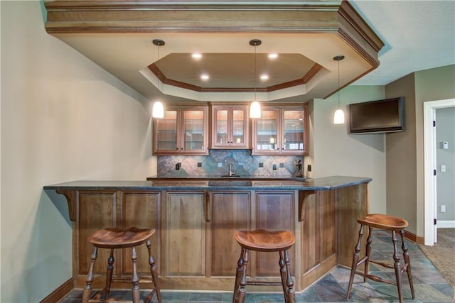 7379 124th St, Chippewa Falls, WI 54729 - indoor wet bar with baseboards, backsplash, crown molding, decorative light fixtures, and a raised ceiling