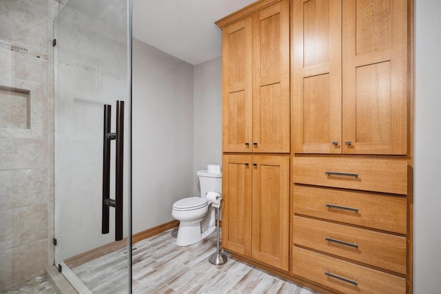 1820 Sampson St, Wisconsin Rapids, WI 54494 - full bathroom featuring toilet, a shower stall, wood finished floors, and baseboards