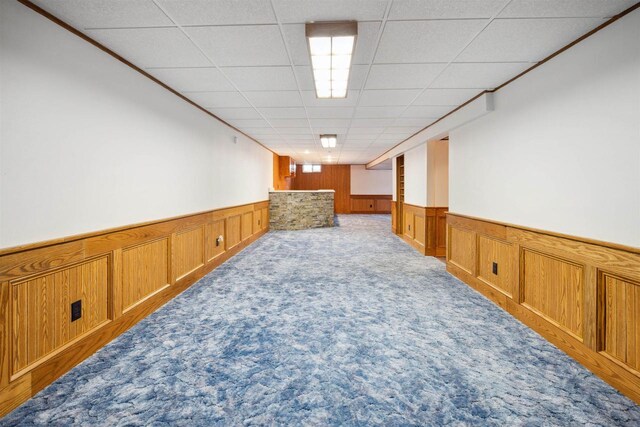1820 Sampson St, Wisconsin Rapids, WI 54494 - finished below grade area featuring a wainscoted wall, carpet, and a drop ceiling