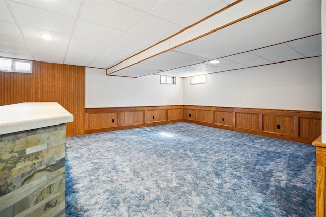 1820 Sampson St, Wisconsin Rapids, WI 54494 - basement featuring carpet, a paneled ceiling, and a wainscoted wall