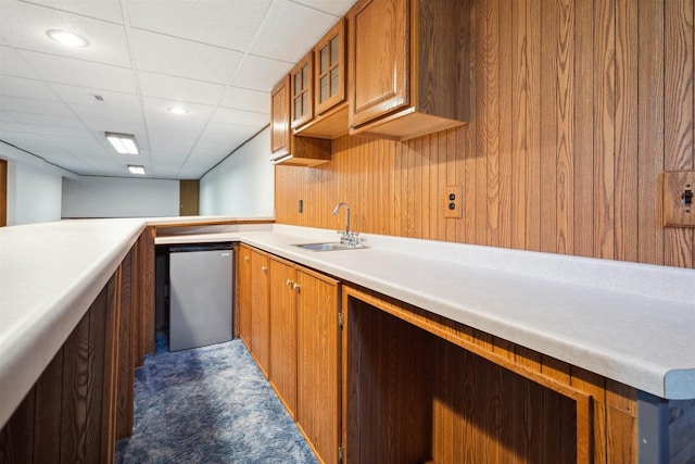 1820 Sampson St, Wisconsin Rapids, WI 54494 - kitchen featuring carpet, a sink, refrigerator, brown cabinets, and light countertops