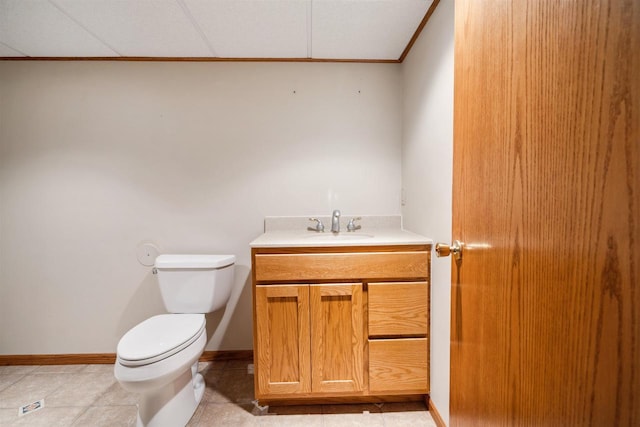 1820 Sampson St, Wisconsin Rapids, WI 54494 - half bathroom with toilet, vanity, ornamental molding, baseboards, and tile patterned flooring