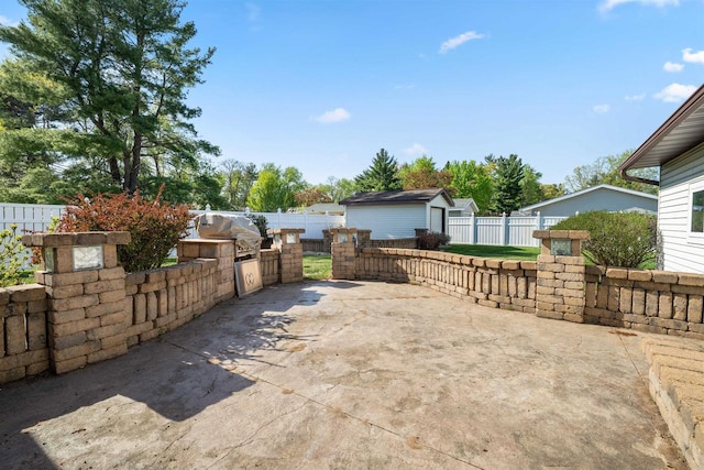 1820 Sampson St, Wisconsin Rapids, WI 54494 - view of patio featuring an outdoor kitchen, a fenced backyard, and an outdoor structure