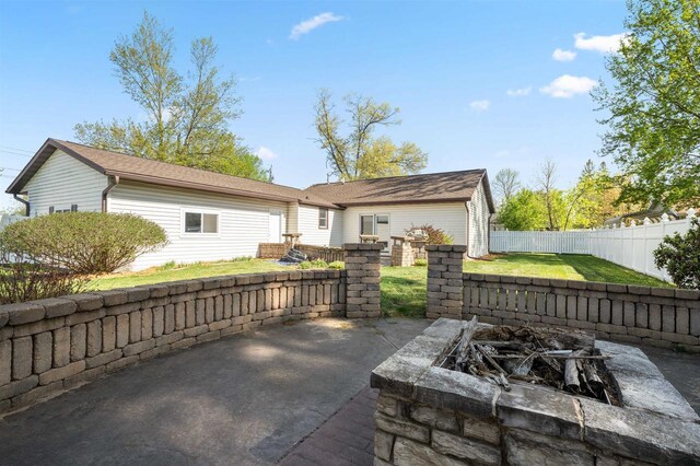 1820 Sampson St, Wisconsin Rapids, WI 54494 - rear view of property featuring a fire pit and a patio area