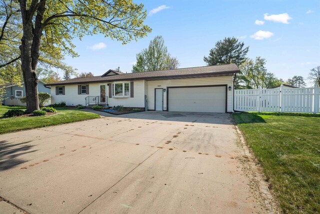 1820 Sampson St, Wisconsin Rapids, WI 54494 - ranch-style house with an attached garage and driveway