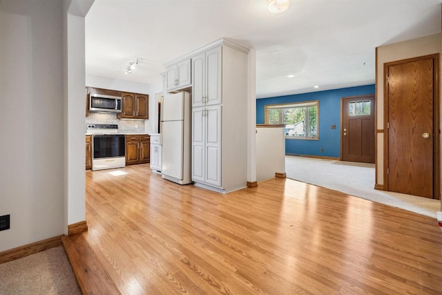 1820 Sampson St, Wisconsin Rapids, WI 54494 - unfurnished living room with light wood-style flooring and baseboards