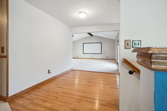 1820 Sampson St, Wisconsin Rapids, WI 54494 - unfurnished living room with light wood-style flooring, baseboards, and lofted ceiling