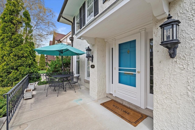 3468 N Summit Ave, Milwaukee, WI 53211 - entrance to property featuring stucco siding and outdoor dining area
