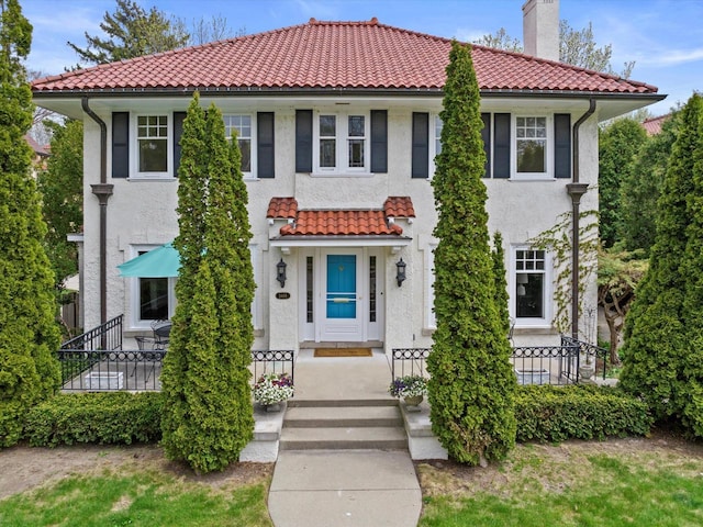 3468 N Summit Ave, Milwaukee, WI 53211 - view of front of home featuring a tile roof, stucco siding, and a chimney