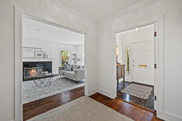 3468 N Summit Ave, Milwaukee, WI 53211 - foyer entrance featuring wood-type flooring, a high end fireplace, ornamental molding, and baseboards