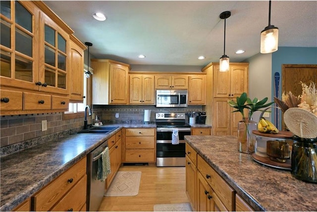 10237 Olker Rd, Hayward, WI 54843 - kitchen with appliances with stainless steel finishes, a sink, dark countertops, and recessed lighting