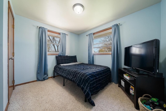 1083 Kenwood St, Green Bay, WI 54304 - carpeted bedroom featuring multiple windows and baseboards