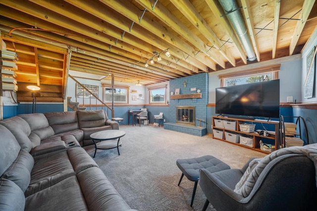 1083 Kenwood St, Green Bay, WI 54304 - carpeted living room with stairs and a brick fireplace