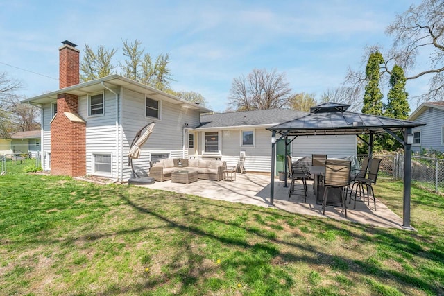 1083 Kenwood St, Green Bay, WI 54304 - rear view of house with an outdoor hangout area, a chimney, a patio area, and a gazebo