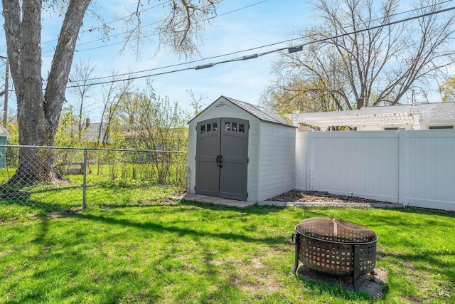 1083 Kenwood St, Green Bay, WI 54304 - view of shed with an outdoor fire pit