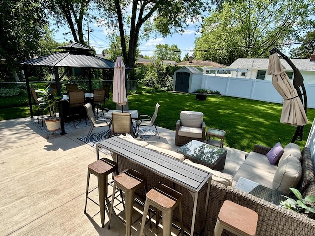 1083 Kenwood St, Green Bay, WI 54304 - view of patio / terrace with outdoor dining space, a storage unit, an outdoor living space, and an outbuilding