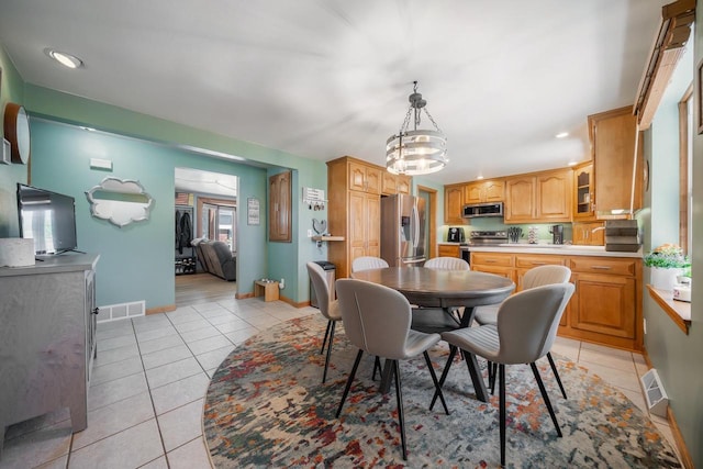 1083 Kenwood St, Green Bay, WI 54304 - dining room featuring light tile patterned floors, baseboards, and recessed lighting
